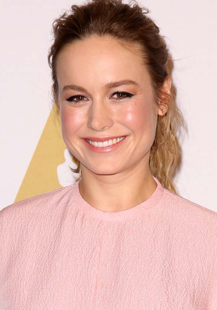 Brie Larson adds a subtle touch of sparkle with Ariel Gordon diamond hook studs earrings, complementing her soft pink Emilia Wickstead top at the 2016 Academy Awards Nominees Luncheon