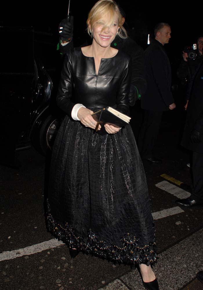 Cate Blanchett radiates edgy elegance in a leather Chanel dress paired with black pointy Rupert Sanderson pumps, a sleek clutch, and a soft, wispy updo