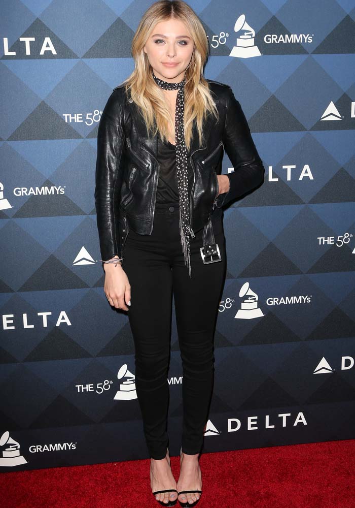 Chloë Grace Moretz wears an all-black look with a leather jacket on the red carpet