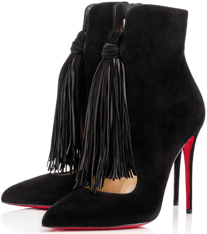 Christian Louboutin Fringed “Ottocarl” Suede Booties in black — a sculptural stiletto design featuring playful cascading tassels and the brand’s signature red-lacquered soles
