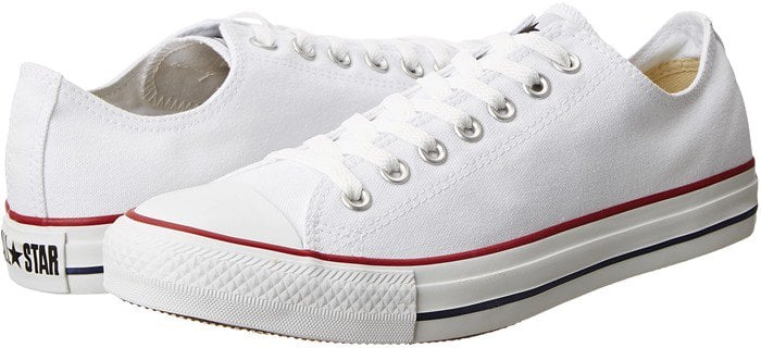The Converse Chuck Taylor All Star Low Top in optical white remains a go-to staple thanks to its canvas upper, rubber toe cap, and endlessly versatile design