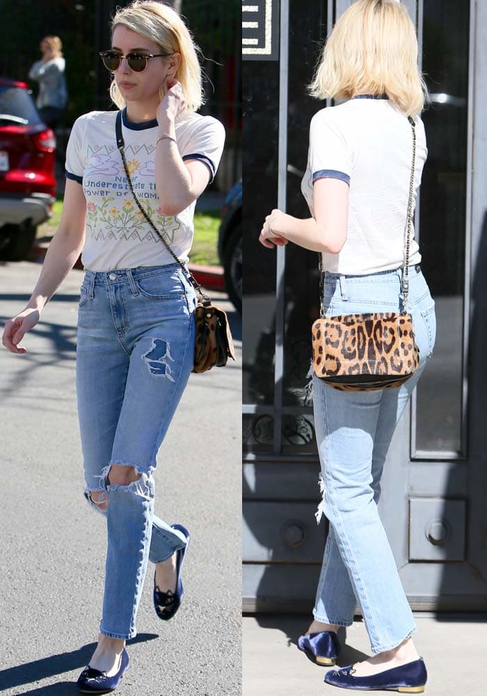 Emma Roberts styled her casual look with ripped high-waisted straight-leg jeans, a bold leopard-print satchel, and Charlotte Olympia’s signature blue velvet “Kitty” flats with gold heels