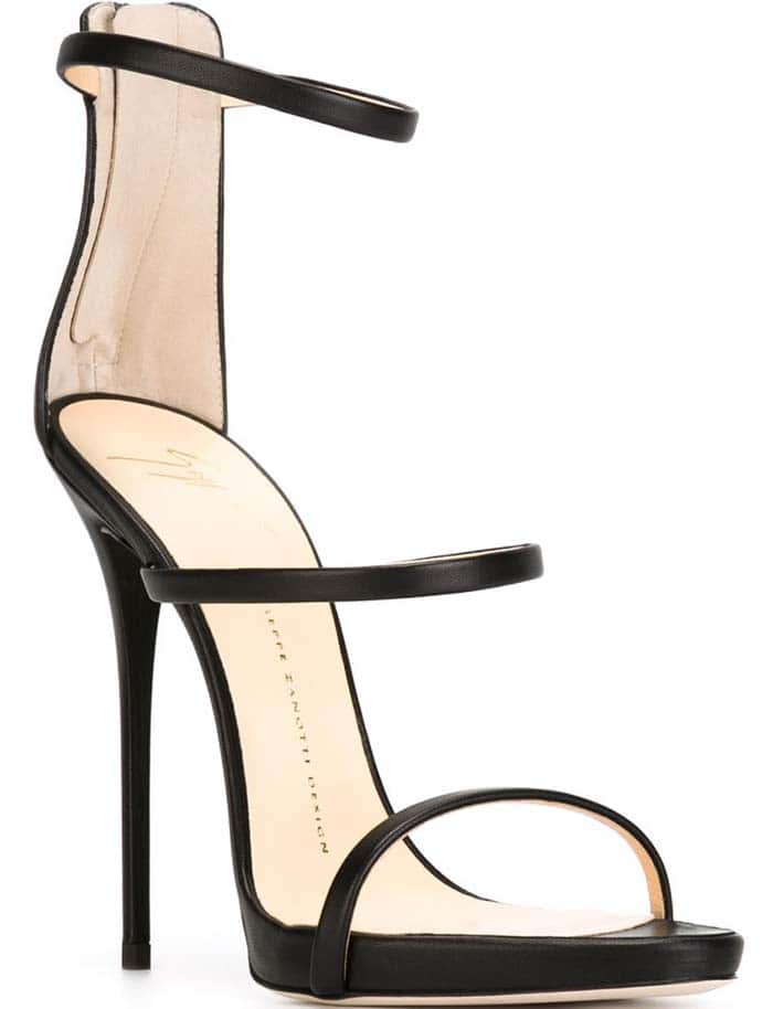 Rendered in black leather, the Giuseppe Zanotti "Coline" sandal highlights the clean architectural lines and sky-high stiletto heel at the heart of the design