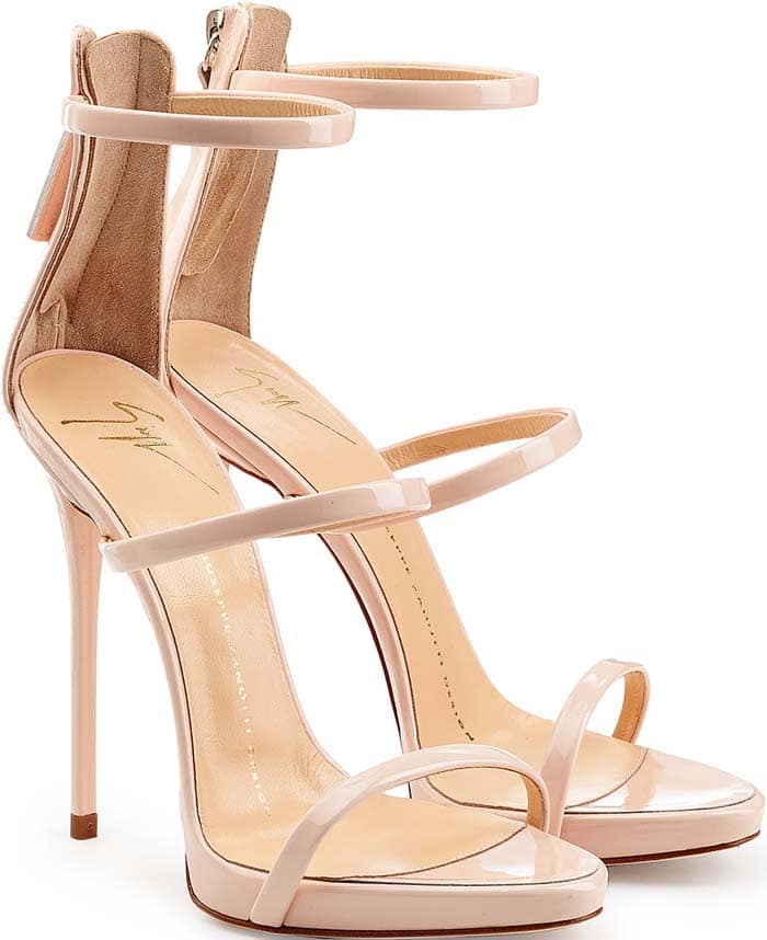 The nude patent Giuseppe Zanotti "Coline" sandal showcases the minimalist three-strap silhouette that made the style a red-carpet favorite throughout the 2010s
