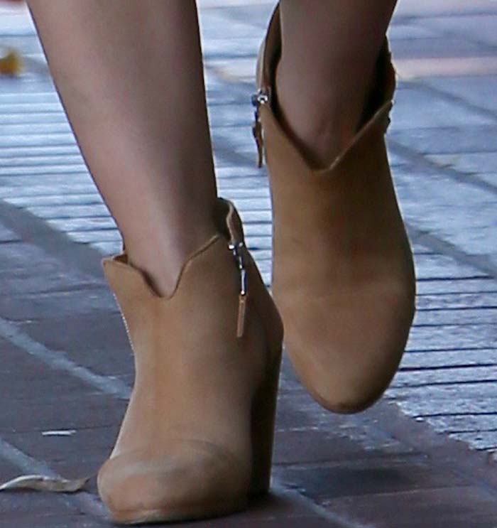The tan suede Rag Bone “Margot” boots added subtle Western-inspired structure to an otherwise relaxed off-duty outfit