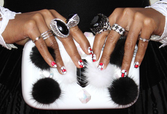 Her playful manicure and fluffy black-and-white Emm Kuo clutch tied the look together, perfectly echoing her signature monochrome palette and fearless approach to accessories