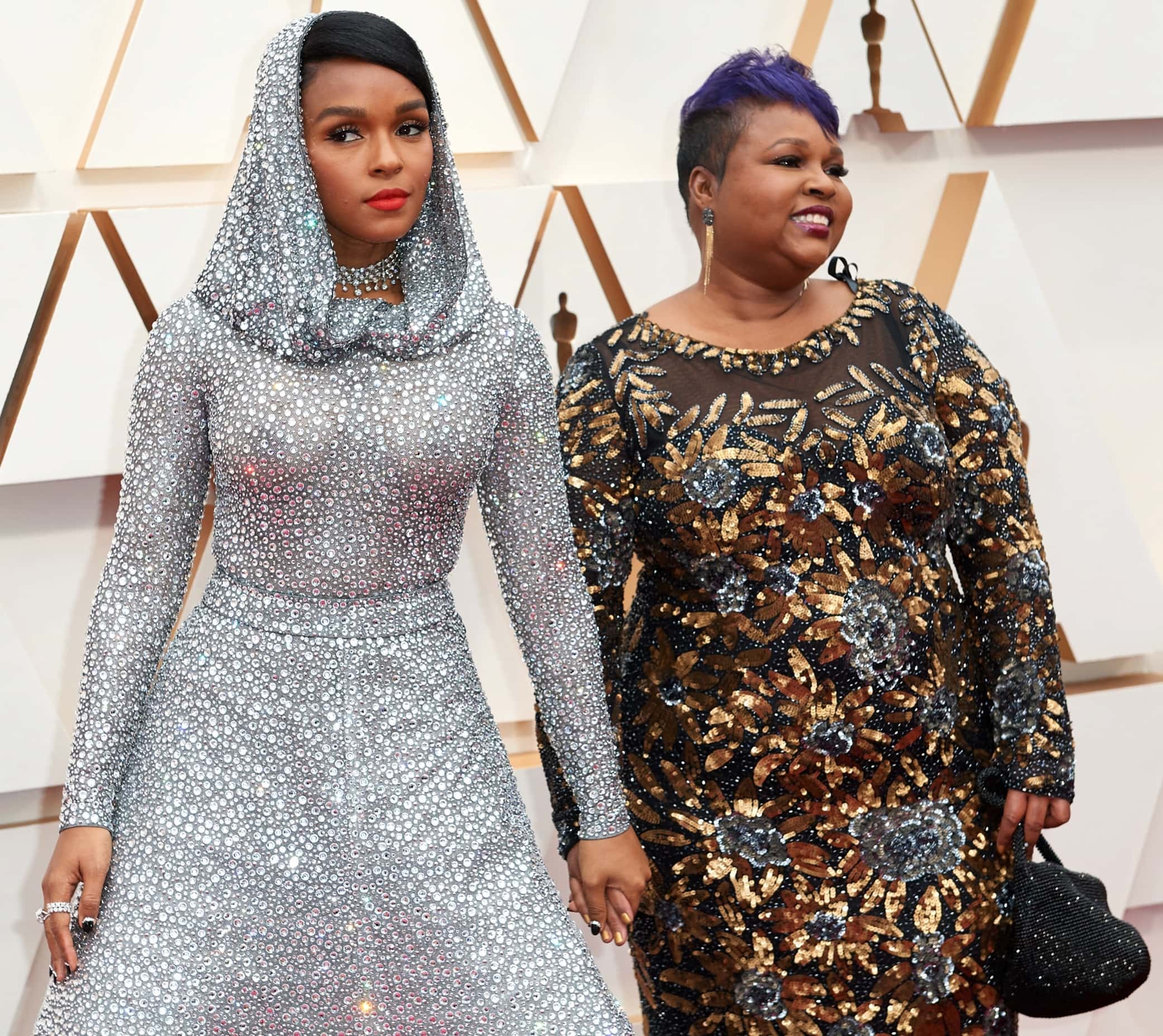 Janelle Monáe was joined by her mother, Janet, who looked radiant in a long-sleeved black gown richly embroidered with gold and blue floral sequins that beautifully complemented her daughter’s sparkling Ralph Lauren look