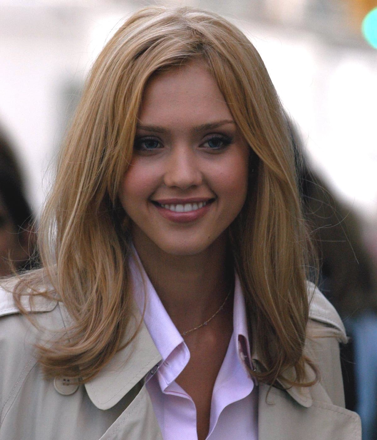 Jessica Alba on the New York set of Fantastic Four in May 2005, channeling her Invisible Woman character with polished blonde hair and a classic trench coat