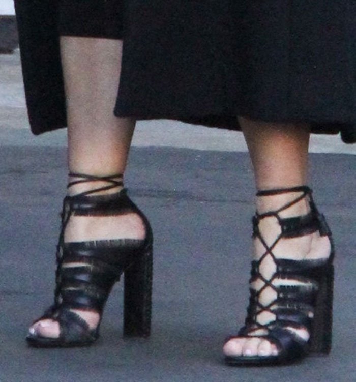 Kim Kardashian in Tom Ford sandals with eyelash fringe trims on the straps, ghillie ties and 4.5-inch whipstitched chunky heels