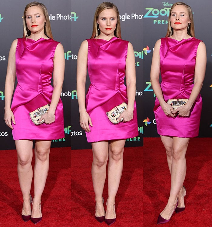 Kristen Bell flaunts her sleek fuchsia dress with confidence, striking various poses that highlight her toned legs, sleek hair, and elegant ensemble at the Zootopia premiere