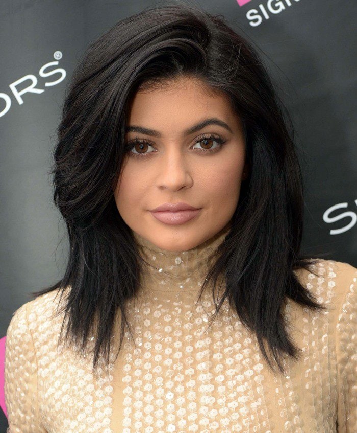Kylie Jenner poses at the SinfulColors launch with softly contoured glam and a sleek, shoulder-length blowout that frames her face