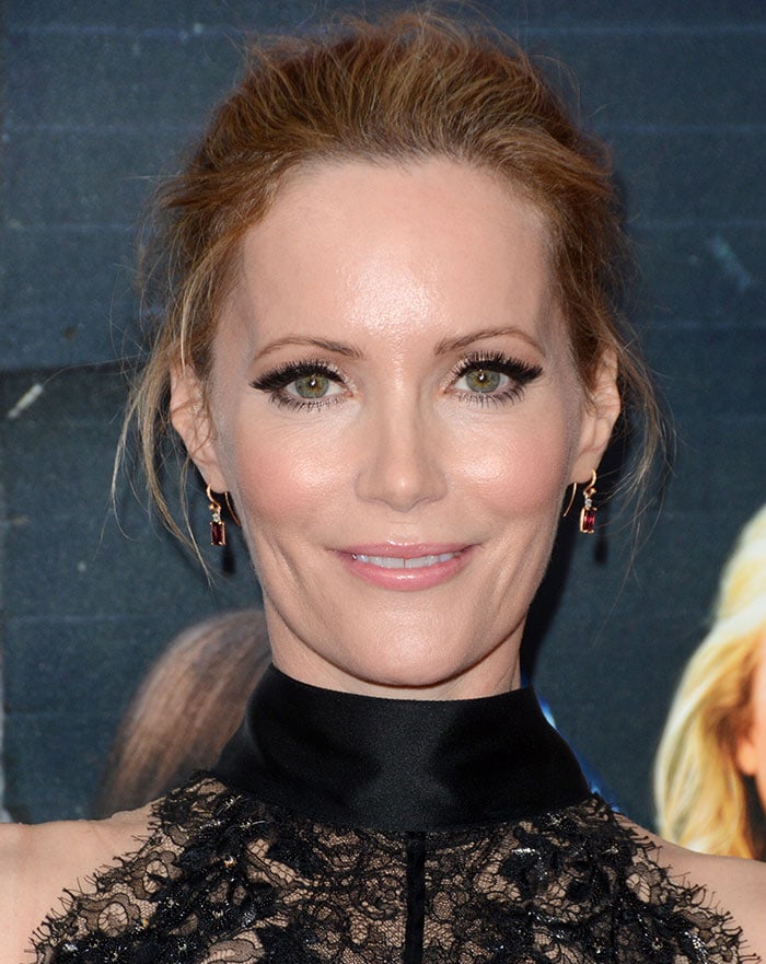 Soft silver eye makeup, a bold red lip, and straight center-parted hair completed Leslie Mann's understated beauty look for a busy day of interviews in Manhattan