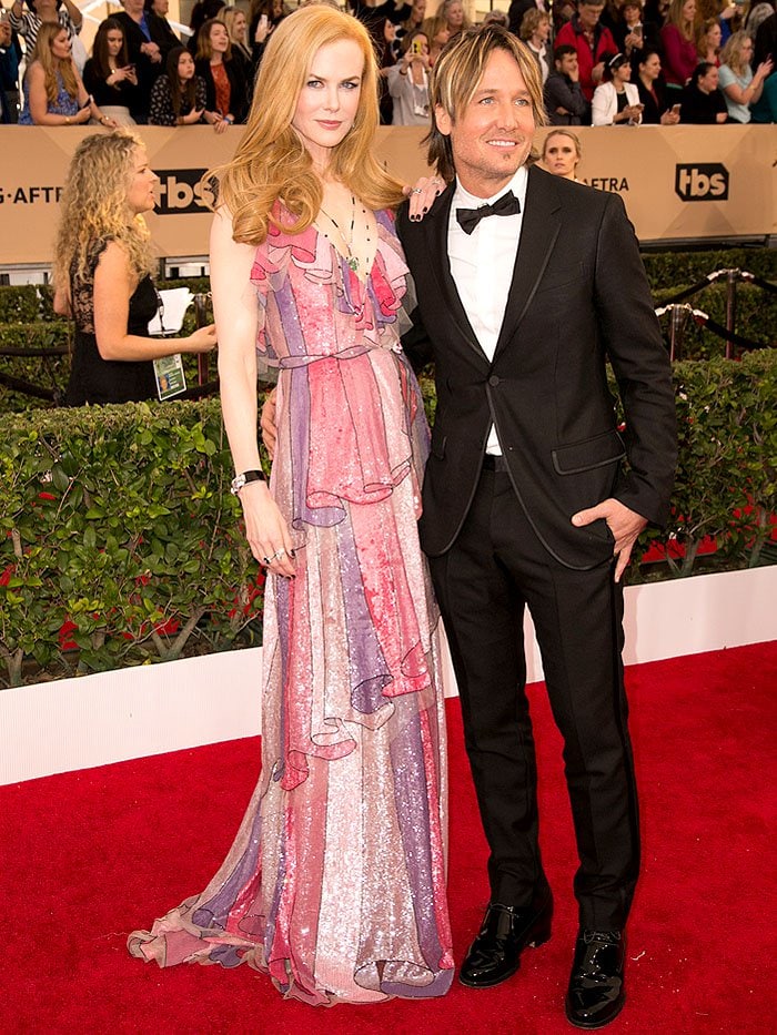 Nicole Kidman and Keith Urban brought contrasting styles to the SAG Awards red carpet, with her shimmering Gucci gown delivering a burst of Alessandro Michele's signature maximalism against his classic black tuxedo