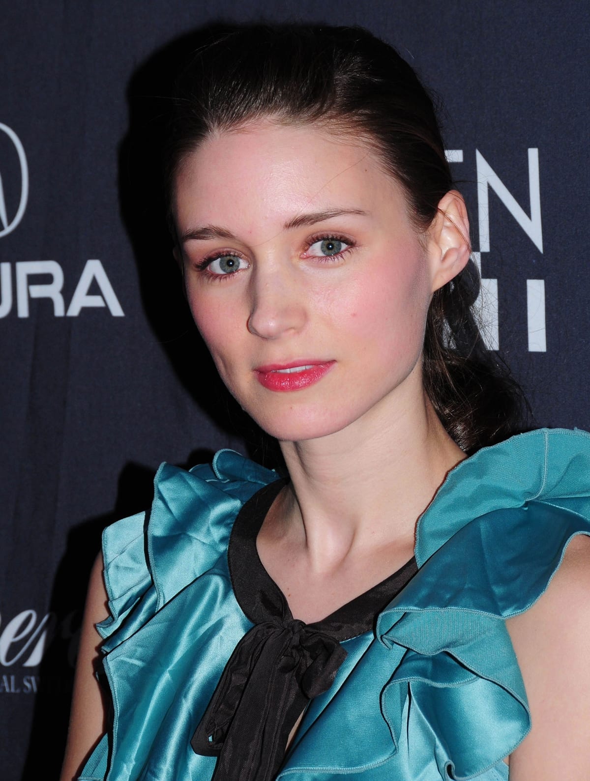 Rooney Mara stuns in a teal ruffled dress, exuding elegance at the Tanner Hall screening