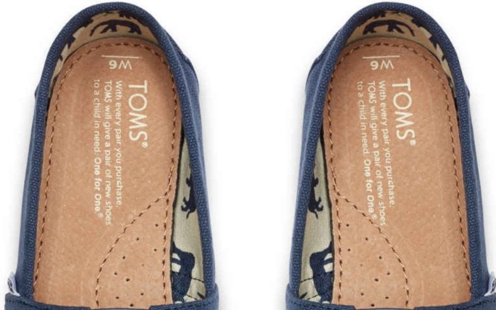 The insoles of authentic TOMS shoes feature the brand’s mission statement printed clearly and evenly — a key detail often missing or poorly replicated in counterfeit pairs