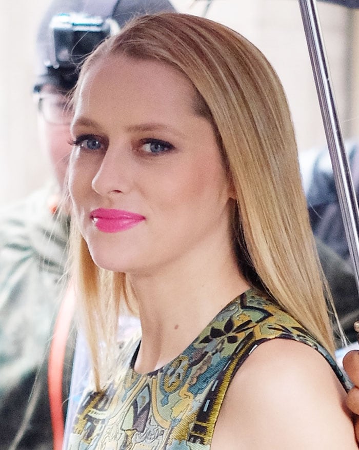 Teresa Palmer looks stunning with sleek straight hair and a bold pink lip, complementing her intricately patterned top during her appearance at Huffington Post Live in Manhattan