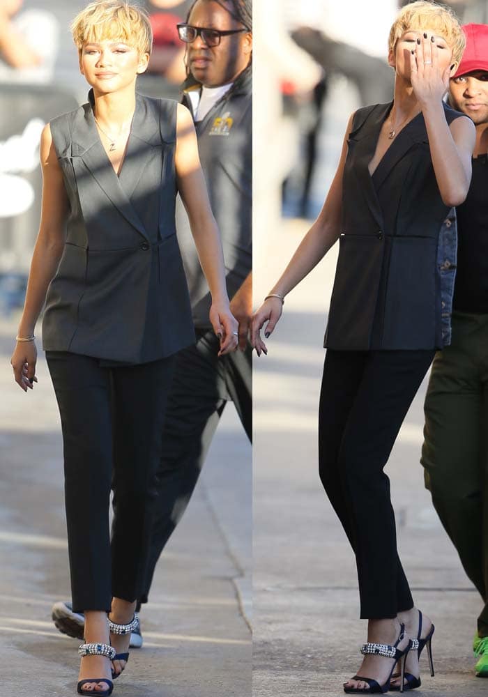 Zendaya wearing a sleeveless double-breasted vest and black trousers with crystal-embellished Giuseppe Zanotti sandals