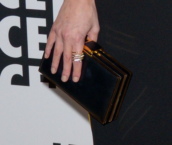 Chloe Bridges toting a black, acrylic clutch