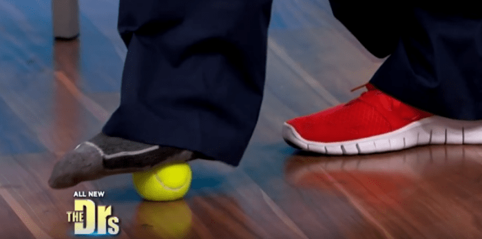 Rolling a tennis ball under your foot is a simple, podiatrist-recommended way to ease heel pain and release tension after wearing high heels