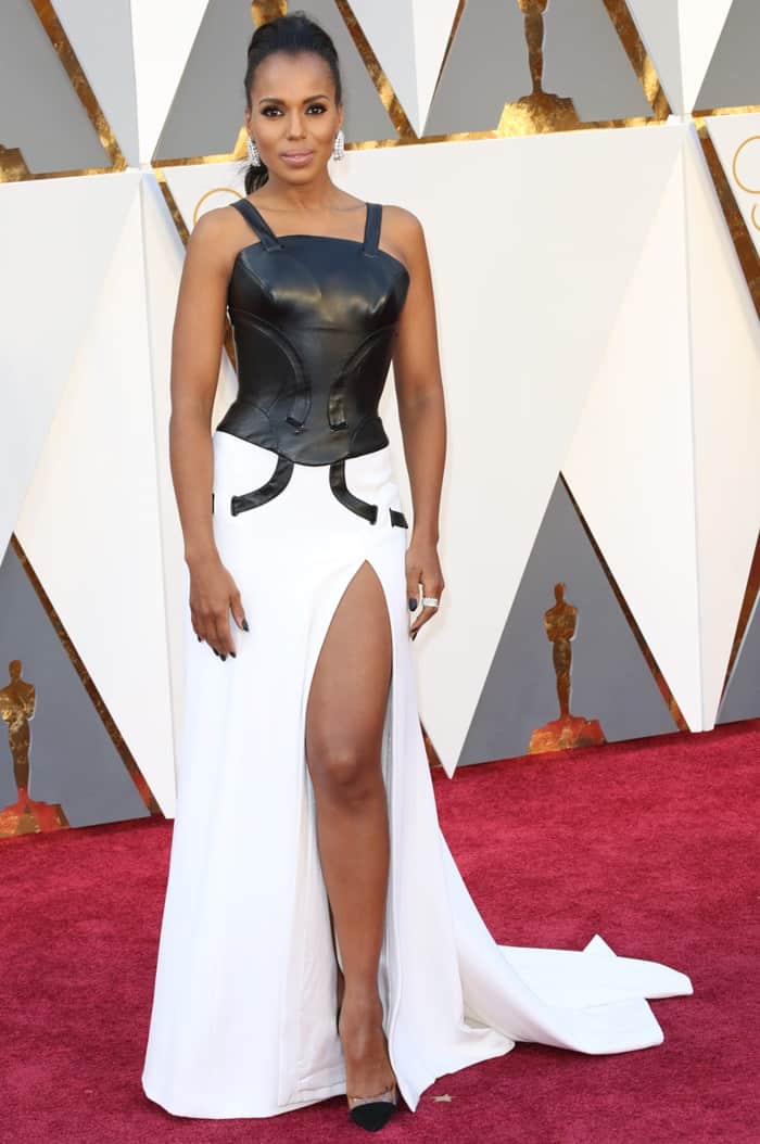 Kerry Washington takes a bold fashion risk in a two-toned Atelier Versace gown with a structured black leather bodice and a flowing white skirt at the 88th Annual Academy Awards