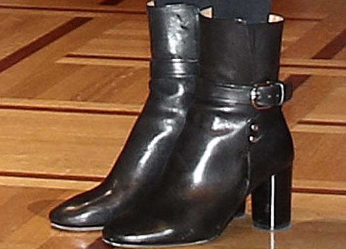 Angelina Jolie’s black Isabel Marant “Raley” ankle boots feature a pointed toe, stacked block heel, and sleek buckle detail that sharpened her monochrome look