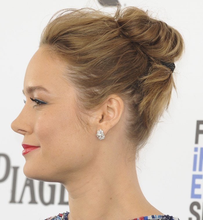 To complete her look, Brie Larson adorned herself with diamond jewelry and styled her hair in an updo