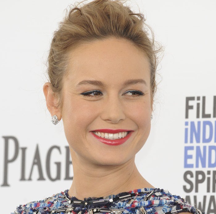 Brie Larson styled her Chanel dress in red, white, and blue with Piaget diamond stud earrings