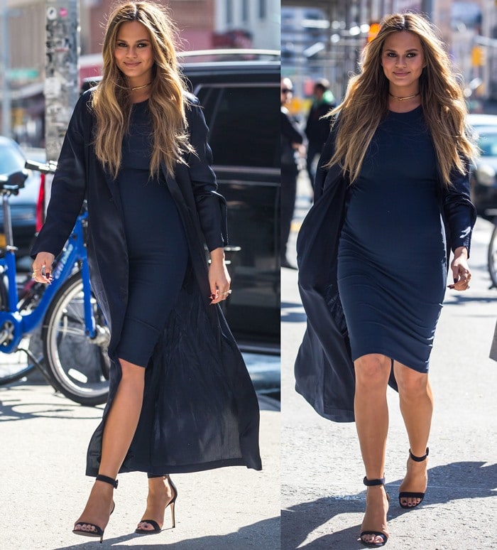 Chrissy Teigen sharpens her sleek all-black maternity look with minimalist Gianvito Rossi Portofino ankle-strap sandals, letting clean lines and sky-high heels do the styling work