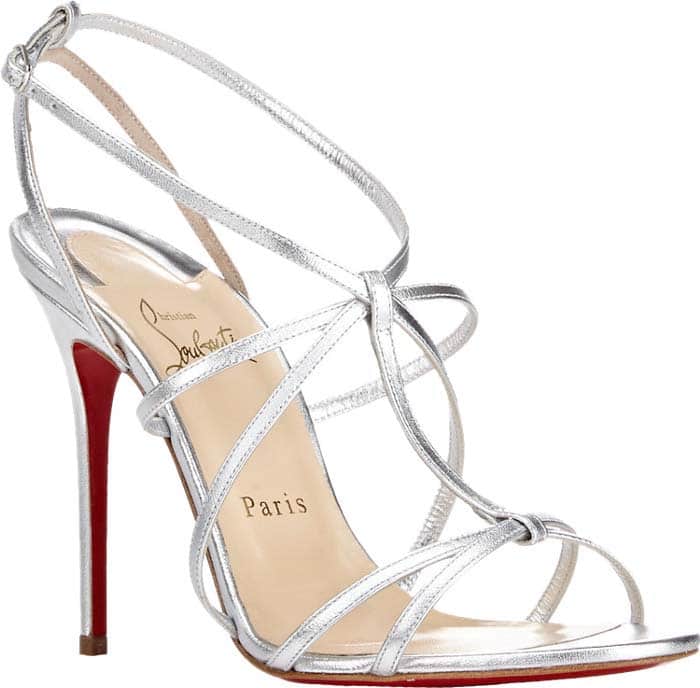 The silver version of the “Youpiyou” sandal offers a sleek, high-shine finish, emphasizing the shoe’s airy structure and leg-lengthening effect