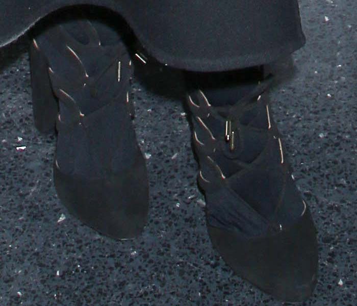 Emily Blunt wears tights underneath her Aquazzura pumps