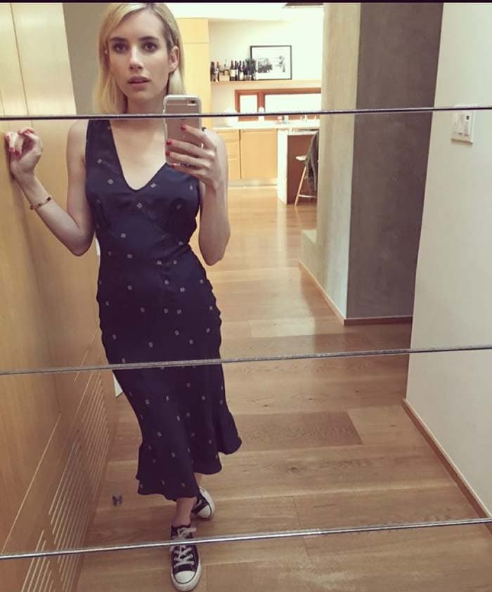 Emma Roberts effortlessly mixes elegance with edge, pairing a chic slip dress with classic Converse sneakers for a laid-back yet stylish Instagram look