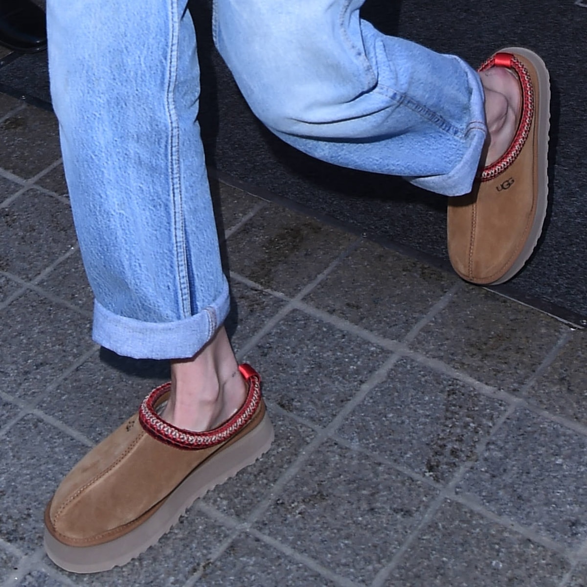 Gigi Hadid's UGG Tazz platform mule slippers are lined with UGGplush, a moisture-wicking textile made from a wool-rich blend but crafted to feel and wear like genuine shearling