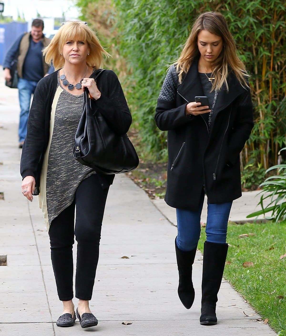 Jessica Alba keeps it casual chic in skinny jeans, knee-high black suede boots, and a quilted-sleeve coat while walking with her mother, Catherine Louisa (née Jensen)
