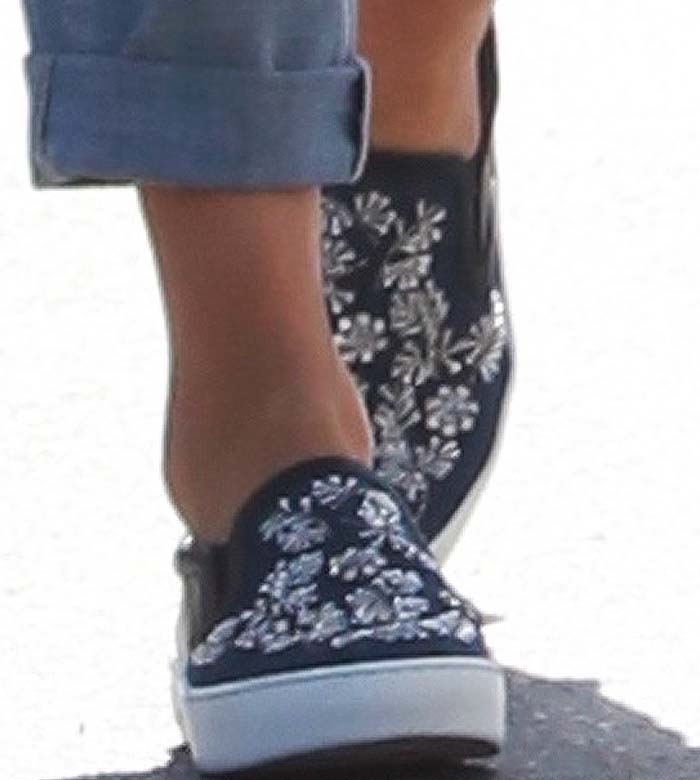 A close-up of Jessica Alba’s Christian Dior “Happy” slip-on sneakers, decorated with sparkling floral embellishments that elevate her off-duty style
