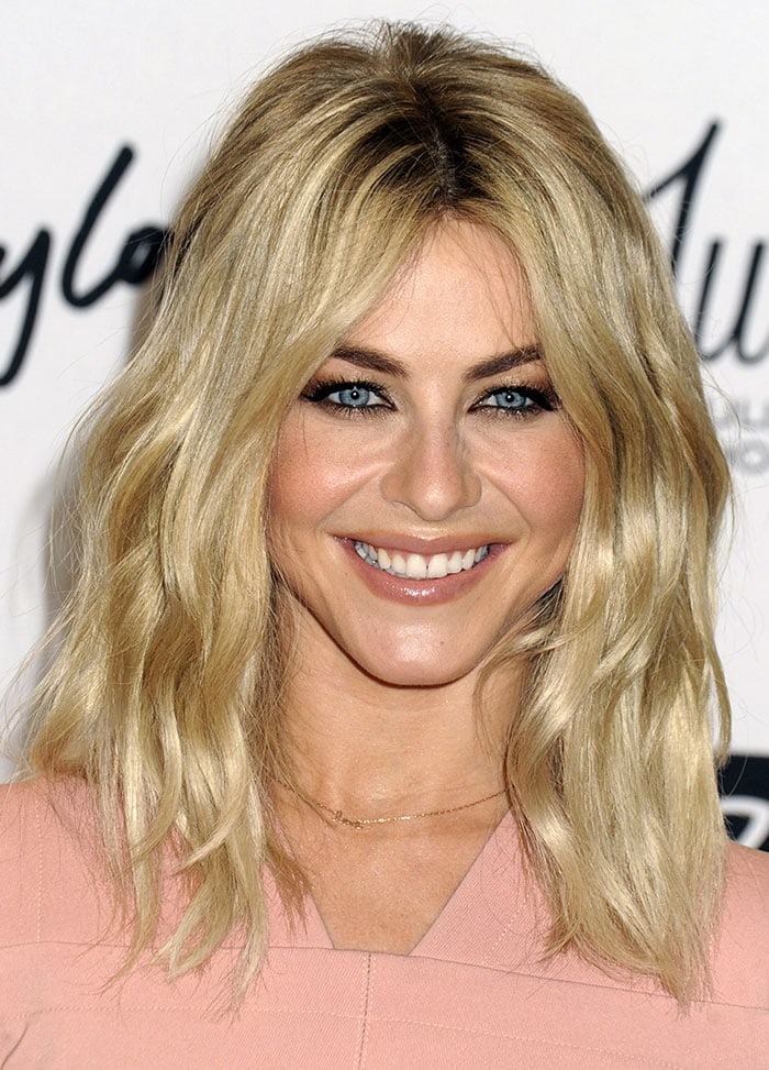 Julianne Hough wears her blonde hair in curls as she visits Lord Taylor for her MPG Activewear launch event
