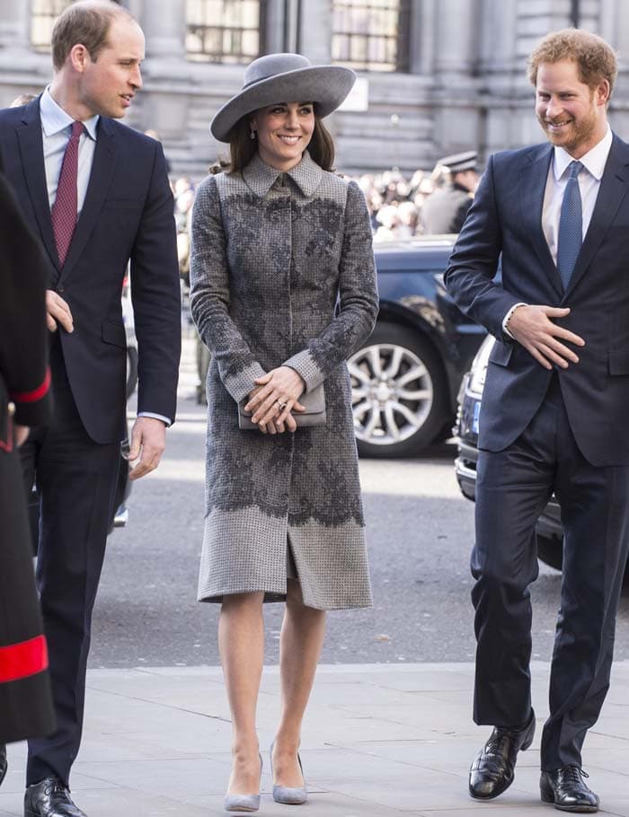 Kate Middleton arrives at Westminster Abbey with Prince William and Prince Harry, pairing her Erdem coat and John Boyd hat with gray suede Rupert Sanderson “Winona” pumps