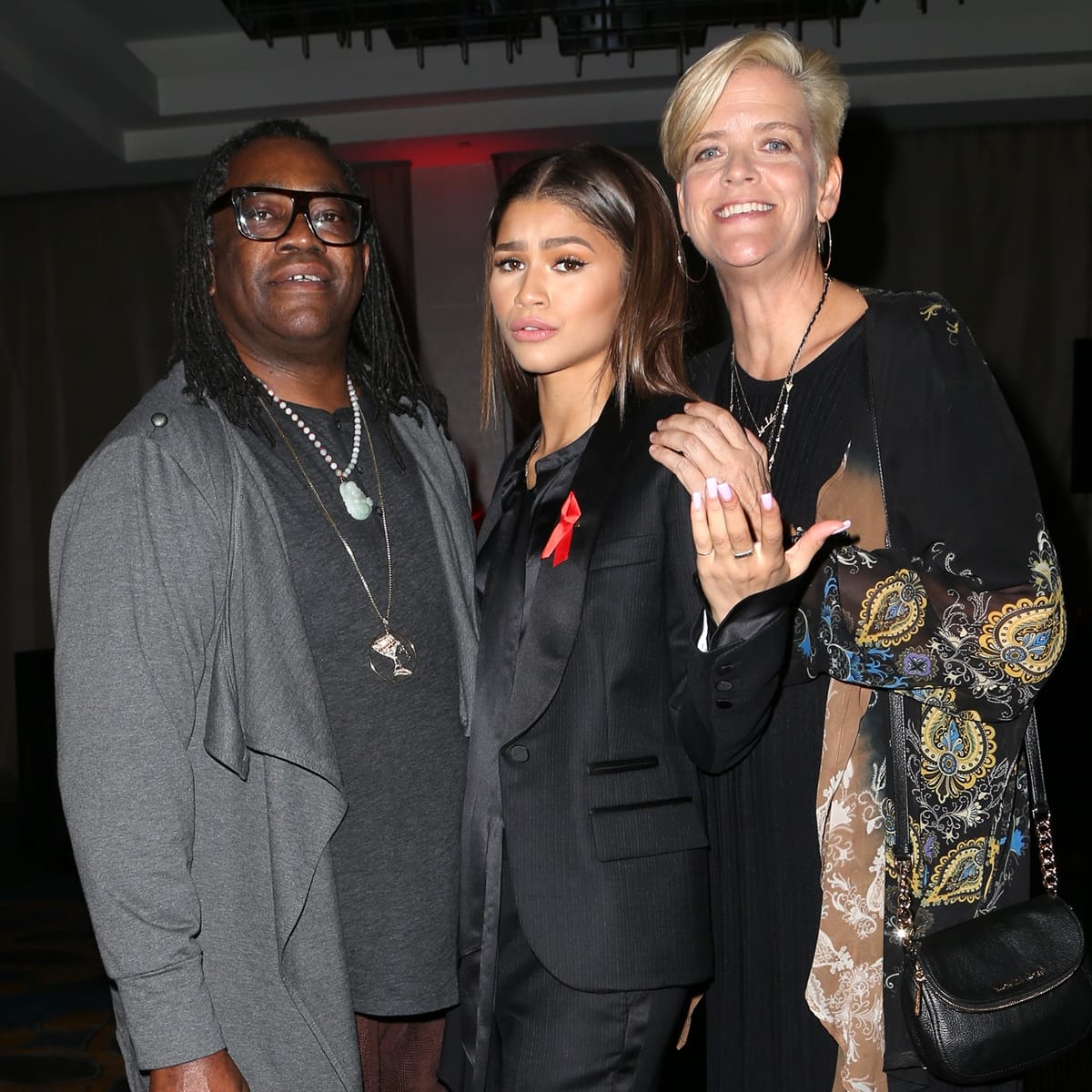Zendaya poses with her parents, Kazembe Ajamu Coleman and Claire Stoermer, highlighting the close family bond behind her Hollywood rise