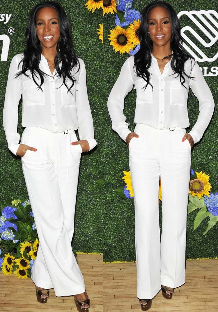 Kelly Rowland sharpens an all-white tailored look with towering metallic Brian Atwood “Tribeca” platform heels while promoting Chasing Destiny in New York City