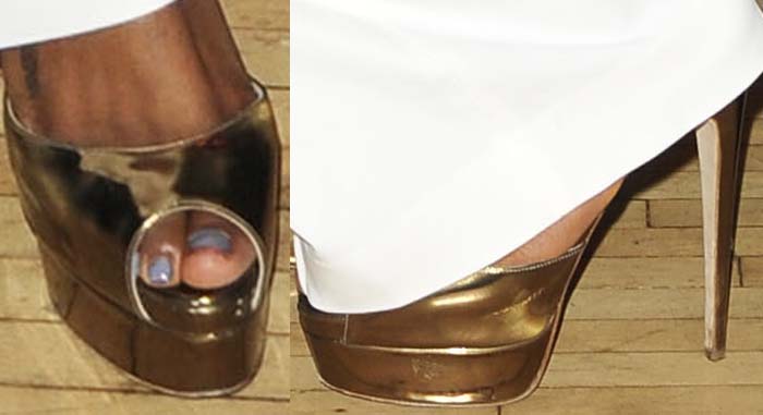 Kelly Rowland’s reflective gold Brian Atwood platforms bring a bold 1970s-inspired finish to her clean monochrome trousers and blouse