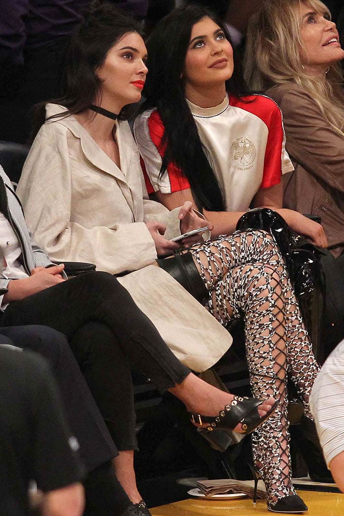 Kendall and Kylie Jenner watching the basketball game between the Los Angeles Lakers and Sacramento Kings at Staples Center in Los Angeles, California, on March 15, 2016