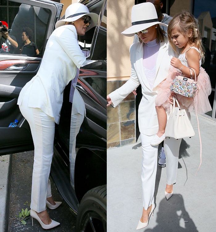 Khloé Kardashian carries her daughter Penelope as she arrives at church