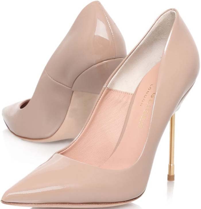 The nude patent version of Kurt Geiger's Britton pump combines leg-lengthening elegance with a sculptural gold-tone heel, balancing classic sophistication with contemporary design