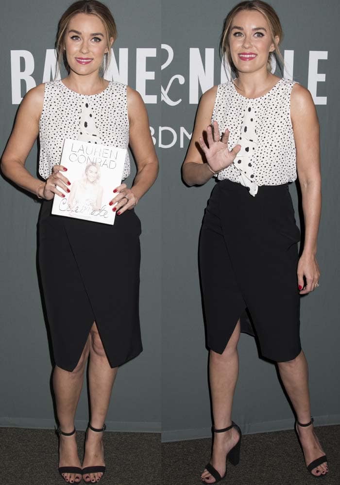 Lauren Conrad pairs a printed Paper Crown ruffle top and black overlay skirt with suede Schutz “Enida” block-heel sandals