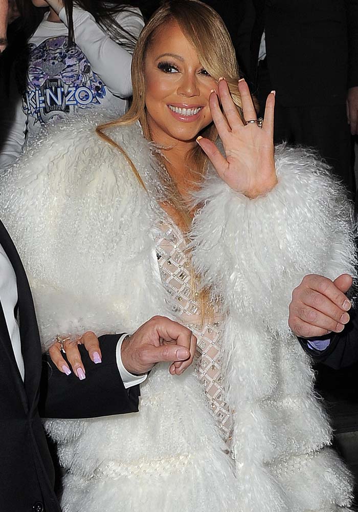 Mariah Carey smiles for the cameras despite being late to her O2 gig in London on March 23, 2016