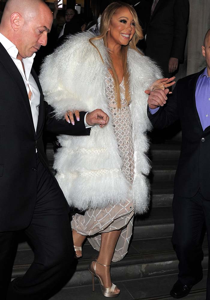 Mariah Carey wearing Temperley London's Alika dress underneath a gigantic white fur coat