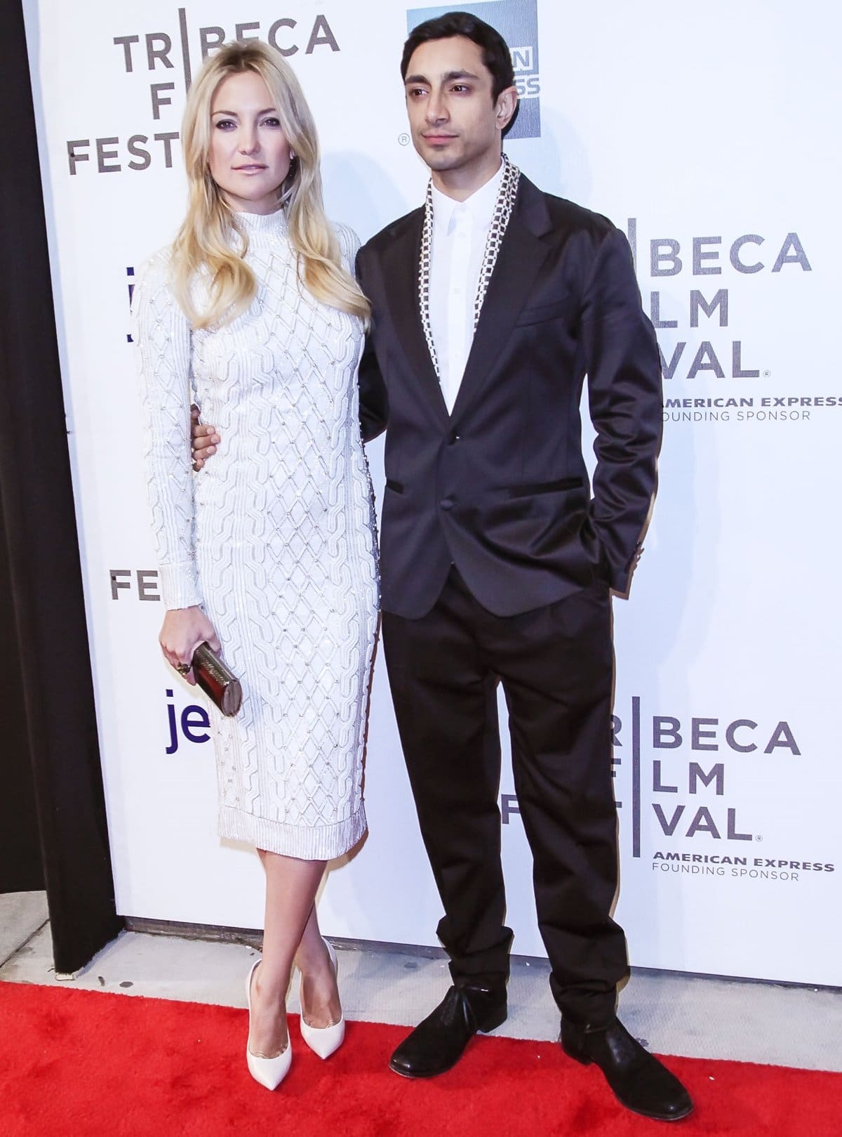 Kate Hudson and Riz Ahmed attend a screening of The Reluctant Fundamentalist at the 2013 Tribeca Film Festival in New York City, with Hudson completing her sculptural white Jenny Packham knit dress with sleek ivory Casadei pointed-toe pumps for a polished red-carpet finish