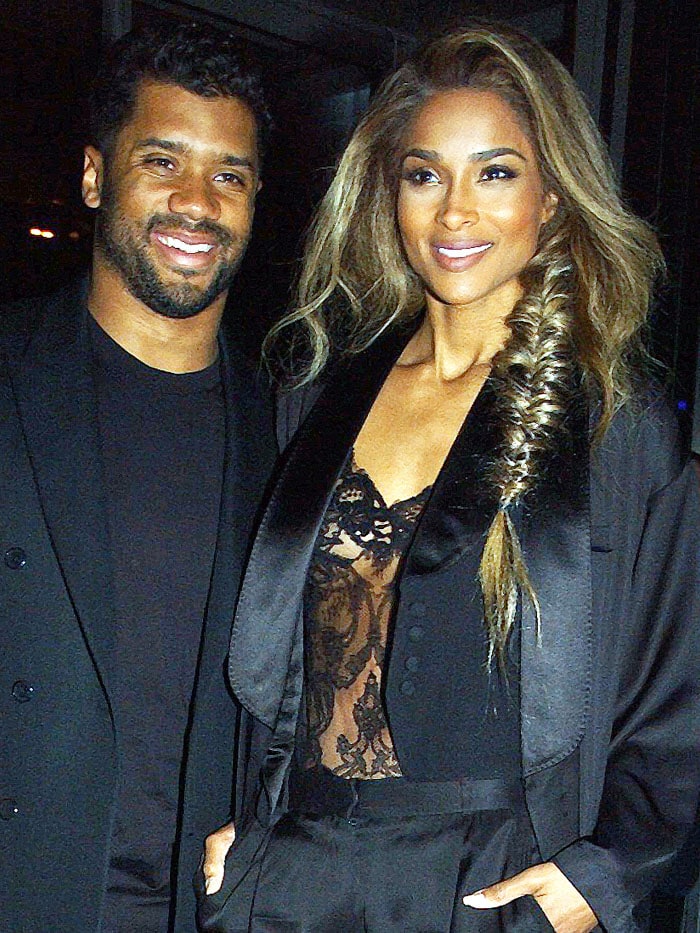 Ciara softens the sharp tailoring with a luminous glow and effortless waves, balancing masculine structure with feminine allure