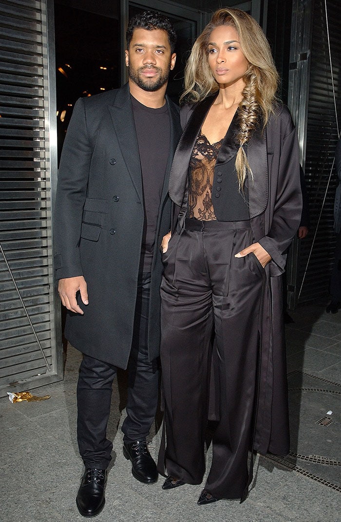 Russell Wilson and Ciara step out in coordinated monochrome, her fluid wide-leg trousers and tuxedo-inspired coat elevating the couple’s understated evening style
