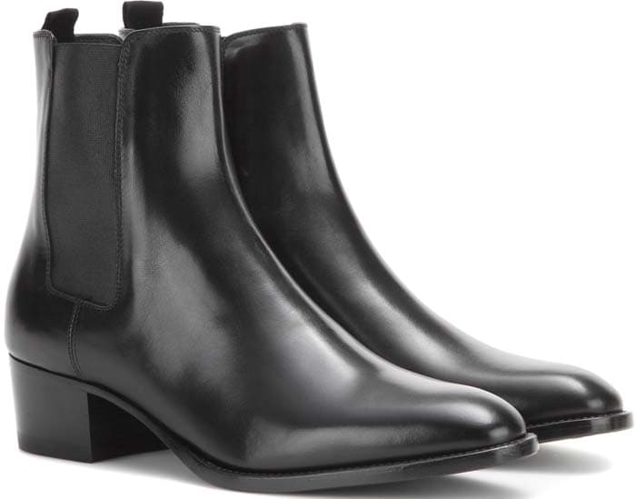 Saint Laurent leather ankle booties in black feature smooth leather construction, elastic side panels, and a wearable 40mm block heel that combines the timeless appeal of Chelsea boots with everyday comfort and versatility