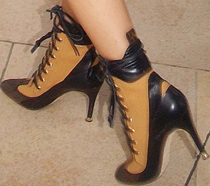 A closer look at Zendaya’s tan-and-black lace-up Louis Vuitton ankle boots, featuring a pointed toe and stiletto heel from the brand’s Spring/Summer 2016 collection